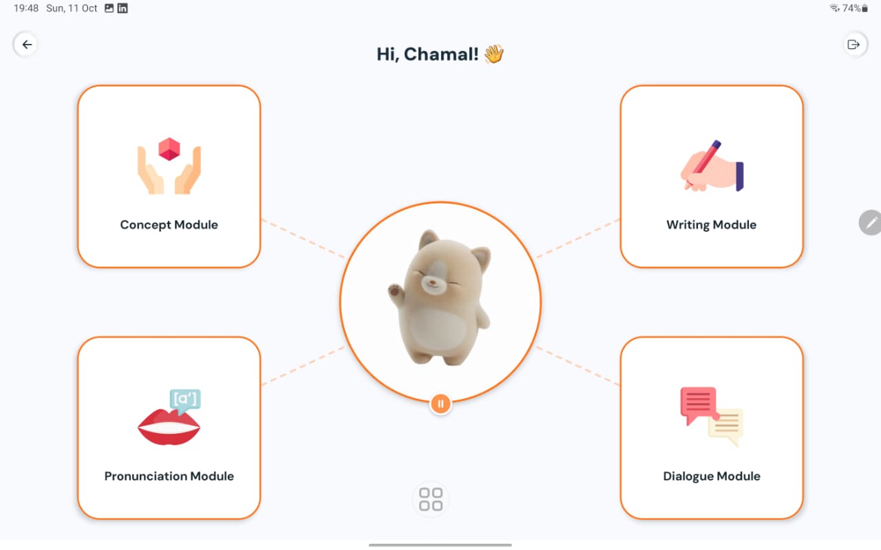 AURIVA app home screen on a tablet: the mascot sits in the middle, surrounded by the Concept, Writing, Pronunciation and Dialogue module buttons.